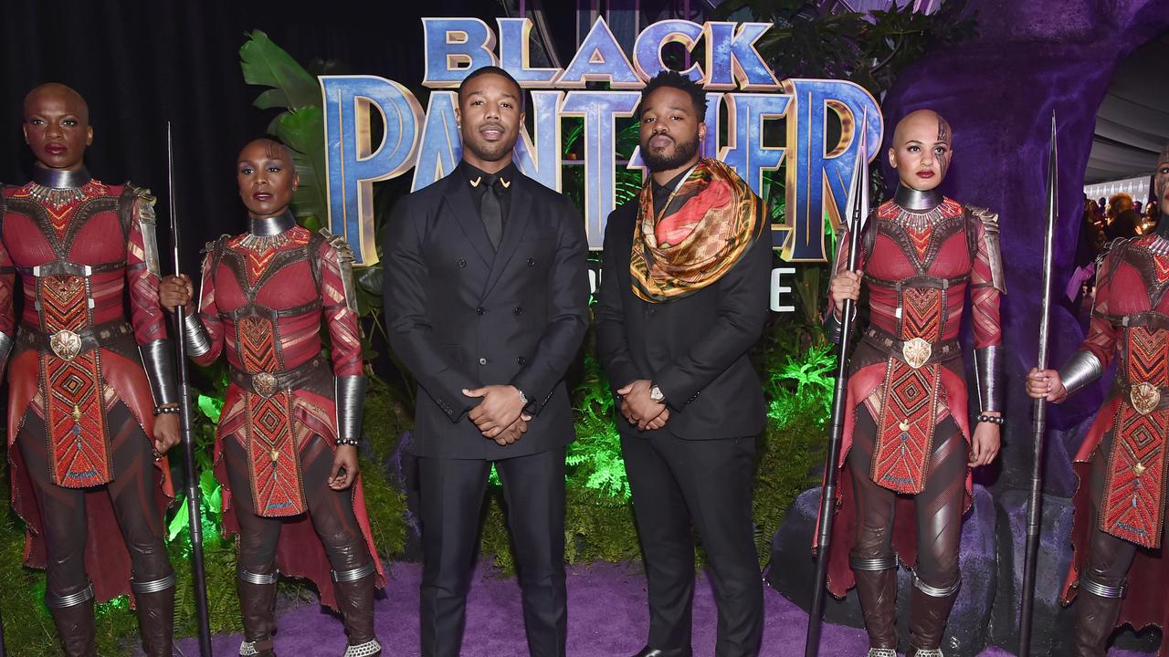 Michael B. Jordan dan sang sutradara Black Panther, Ryan Coogler, berpose di purple carpet