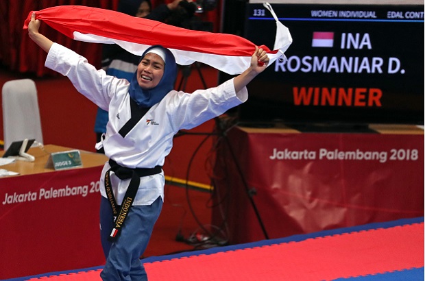 Defia Rosmaniar, mengukir sejarah merebut medali emas pertama untuk Indonesia dari cabang Taekwondo, Minggu, 19 Agustus 2018.