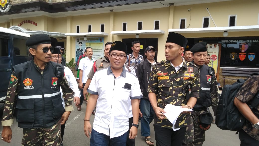 GP Ansor Kabupaten Malang melaporkan Sa'adullah Basuni ke Polres Malang, Sabtu 5 Januari 2019. (Foto: Umar/ngopibareng.id)