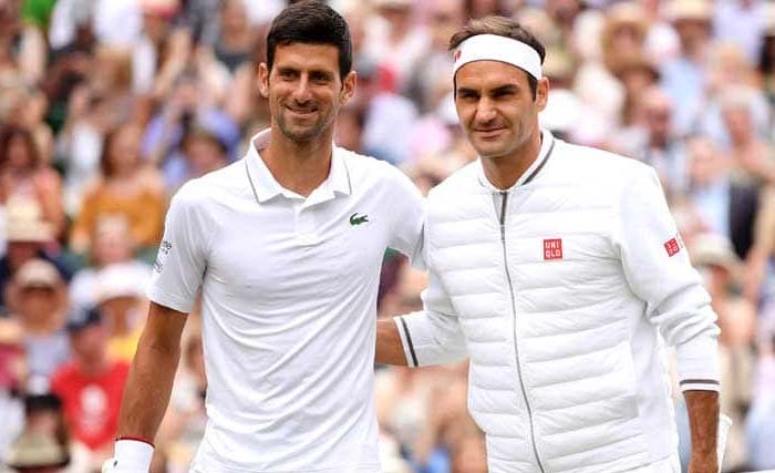 Novac Djokovic  (kiri) dan Roger Federer dalam final terlama dalam sejarah Wimbledon, yang dimenangkan Djokovik. (Foto:AFP)
