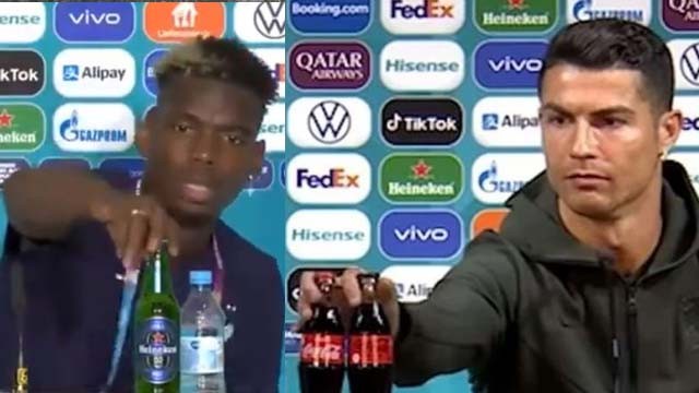 Bintang Portugal Cristiano Ronaldo (kanan) dan bintang Prancis Paul Pogba saat menyingkirkan botol minuman sponsor dari atas meja saat konpers dengan wartawan. (Foto:Reuters)
