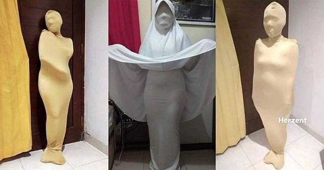 Istri dibungkus kain secara rapat oleh suami dari ujung kepala hingga kaki. Istri juga berpose mengenakan hijab, blazer meski kondisinya hamil. (Foto: Facebook Herman Zent)