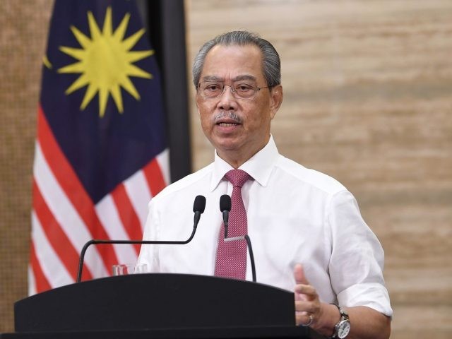 PM Malaysia Muhyiddin Yassin beserta jajaran kabinetnya didesak mundur, buntut dari pencabutan izin darurat Covid-19. (Foto: Istimewa)