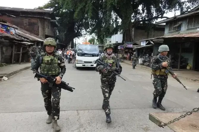 Pulau Mindanao menjadi pusat penduduk Filipina yang beragama Islam. Tampak, sejumlah petugas keamanan di Sulu, Mindanao (Foto: Channel News Asia).