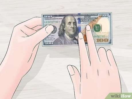 Panduan singkat melihat uang palsu dolar. (wikihow.com)